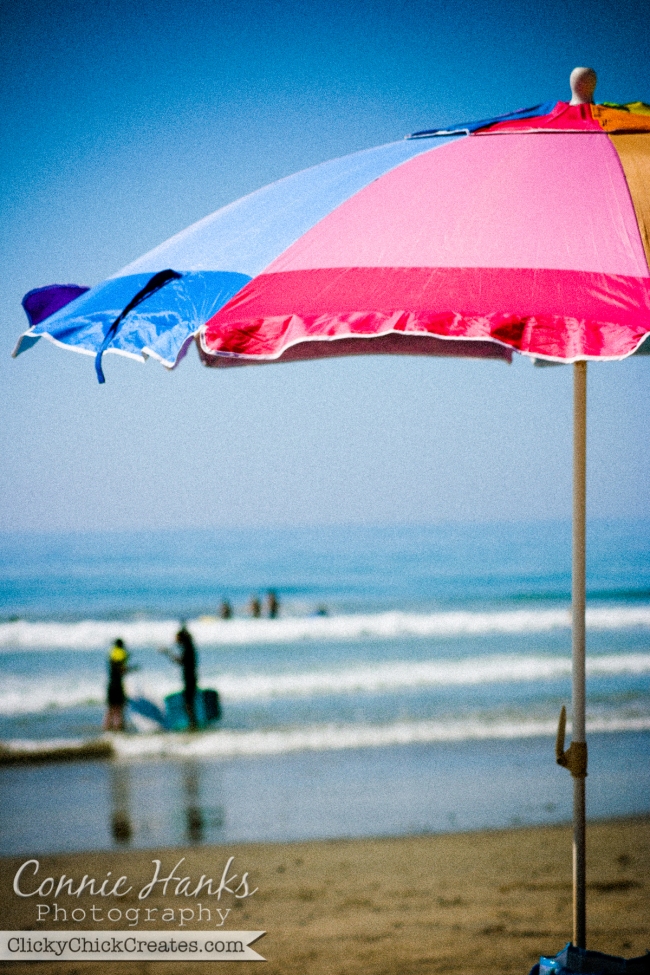 Connie Hanks Photography  //  ClickyChickCreates.com  //  colorful beach umbrella and ocean scene on sunny day