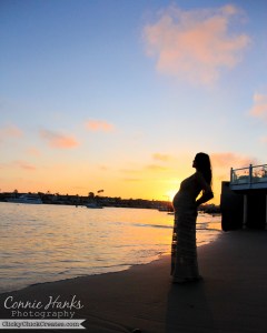Connie Hanks Photography // ClickyChickCreates.com // Sunset silhouette shot on the beach of pregnant mommy-to-be