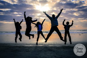 Connie Hanks Photography // ClickyChickCreates.com // family of five, family photo, beach, cuddle, love, silhouette