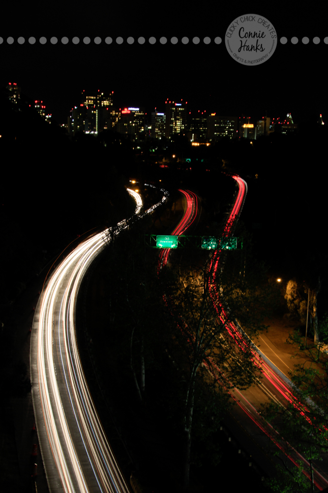 Connie Hanks Photography // ClickyChickCreates.com // Long exposure shot from bridge in Balboa Park over 163 with San Diego skyline in the background