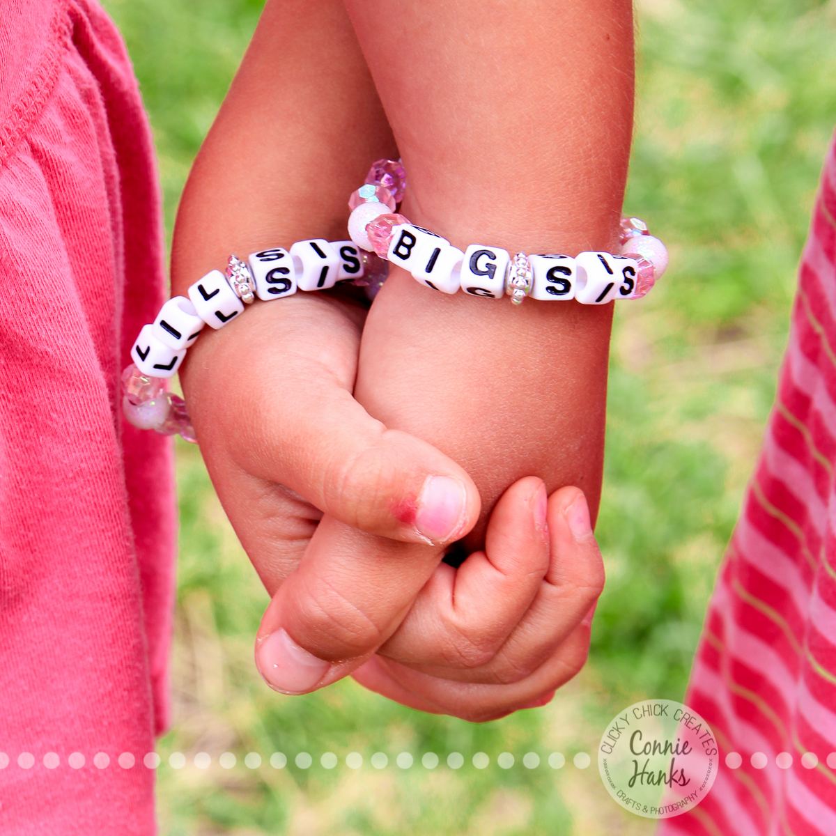 Connie Hanks Photography // ClickyChickCreates.com // Handful of Sisterly Love, little girls wearing matching "Big Sis" and "Lil Sis" bracelets